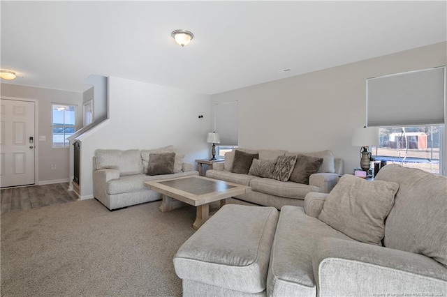 living room featuring a healthy amount of sunlight and light colored carpet