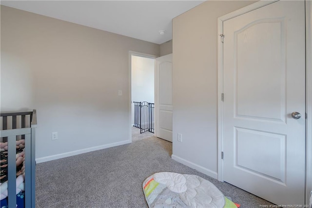 bedroom featuring light colored carpet