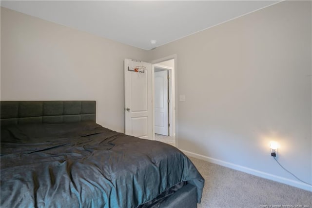 bedroom featuring light carpet