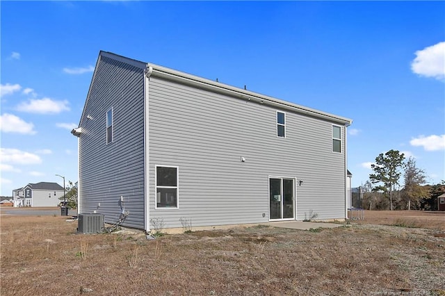 back of house featuring cooling unit and a patio area