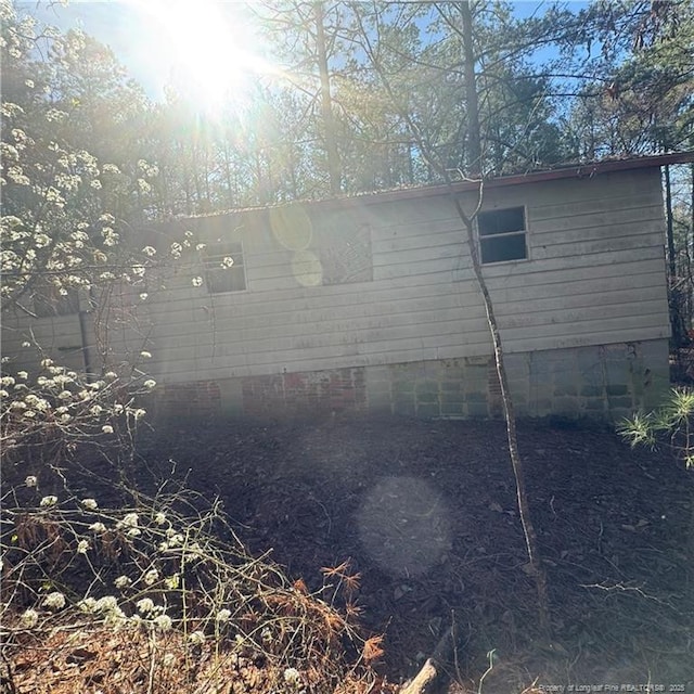 view of side of property featuring crawl space