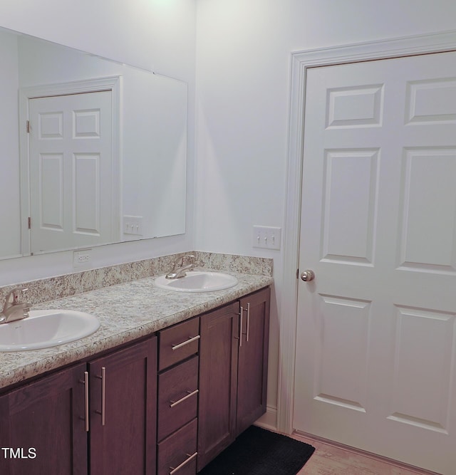 bathroom featuring vanity and wood-type flooring