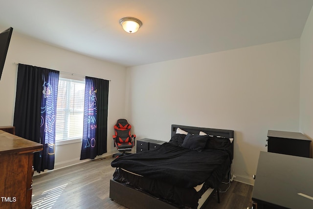 bedroom with hardwood / wood-style floors