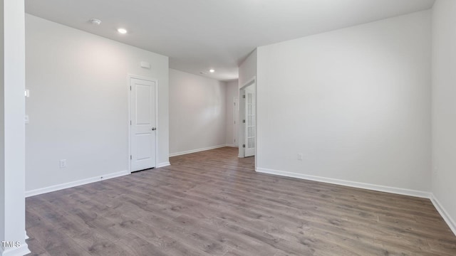 spare room featuring light hardwood / wood-style flooring