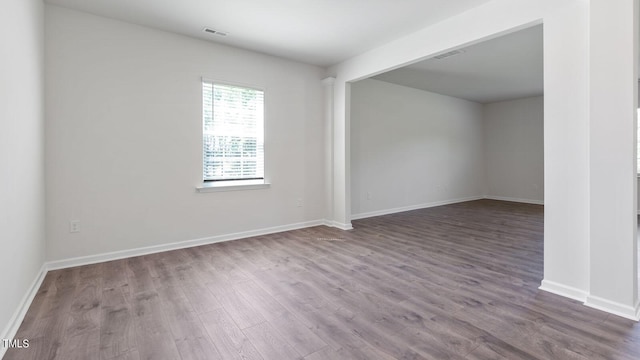 empty room featuring hardwood / wood-style flooring