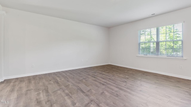 unfurnished room with light hardwood / wood-style flooring