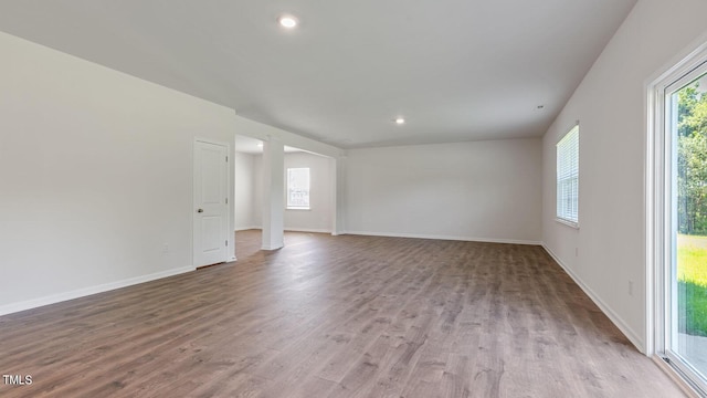 empty room with light hardwood / wood-style flooring