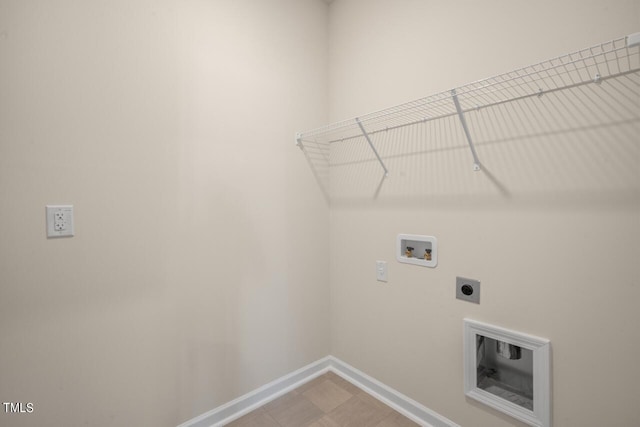 clothes washing area with hookup for a washing machine and hookup for an electric dryer