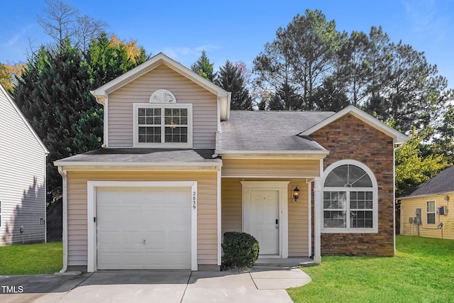 view of front of home featuring a garage and a front lawn