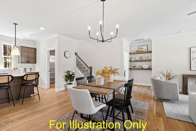 dining room with light hardwood / wood-style flooring, a notable chandelier, and crown molding