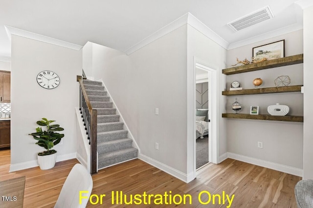 stairs featuring crown molding and hardwood / wood-style flooring