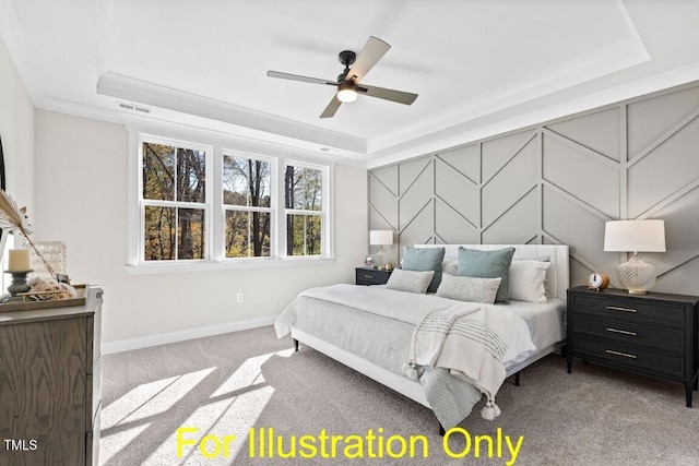 carpeted bedroom with ceiling fan, crown molding, and a tray ceiling