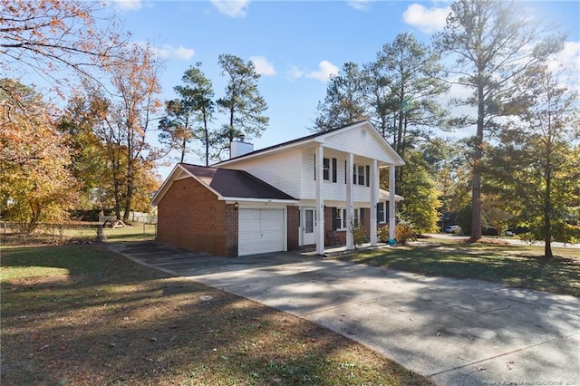 view of front facade featuring a garage and a front lawn