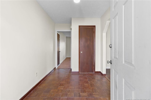 hall with dark parquet floors