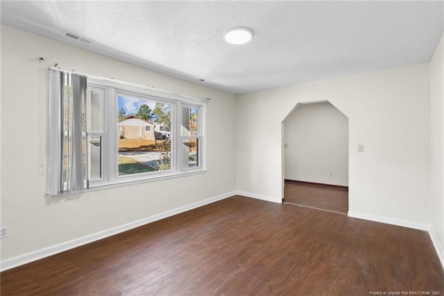 bonus room with dark hardwood / wood-style flooring