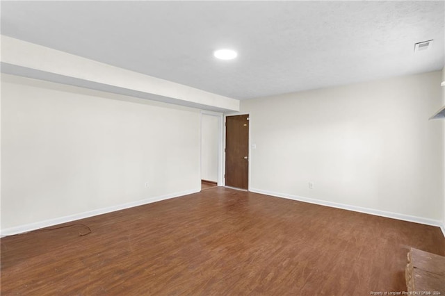 basement featuring dark wood-type flooring