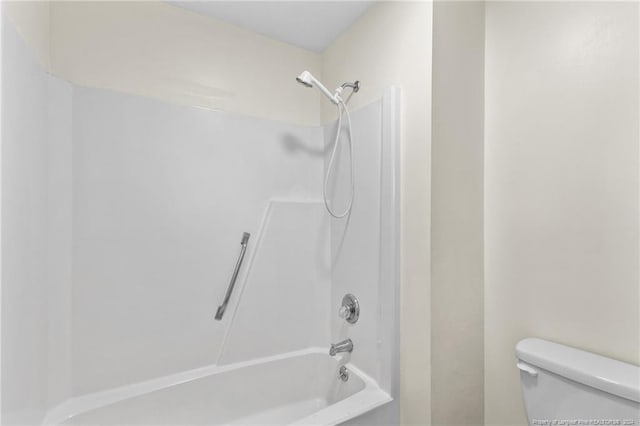 bathroom with shower / bathtub combination and toilet