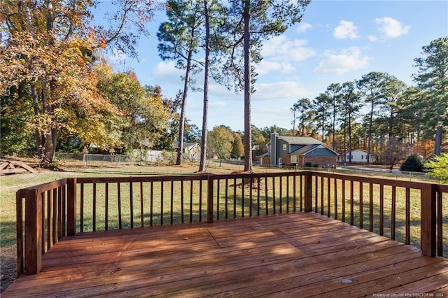 wooden terrace with a yard