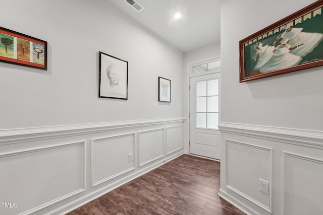 hallway featuring dark hardwood / wood-style flooring