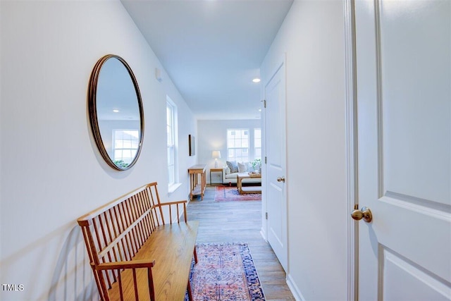 hall with hardwood / wood-style floors