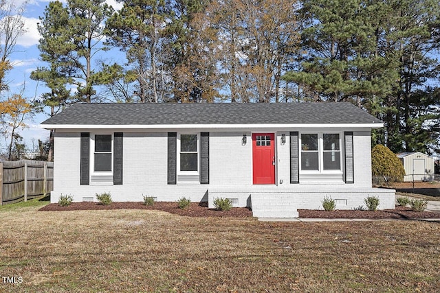 ranch-style home with a front lawn