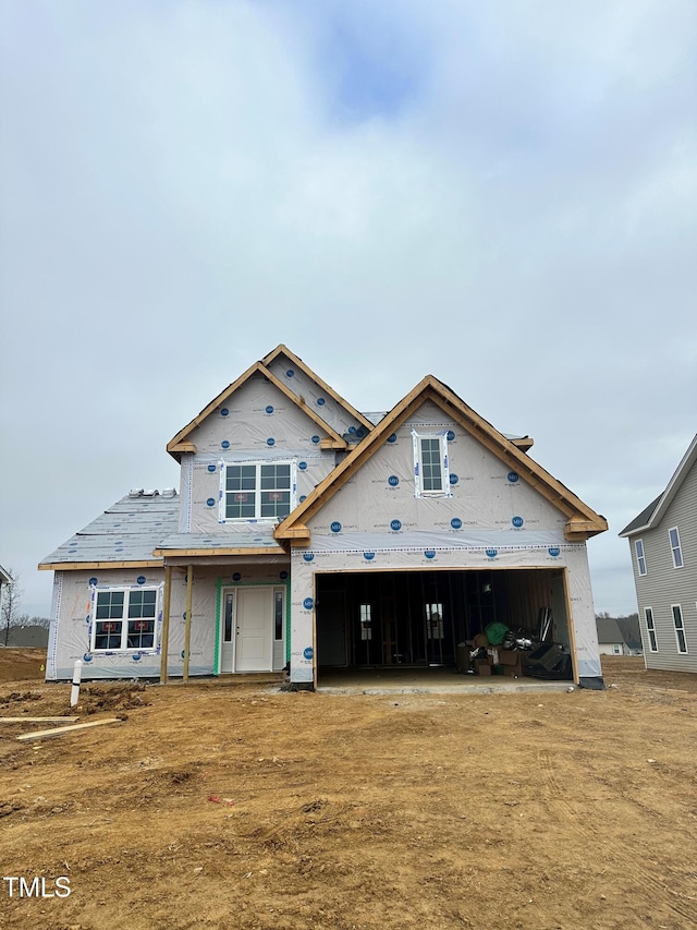 unfinished property with a garage