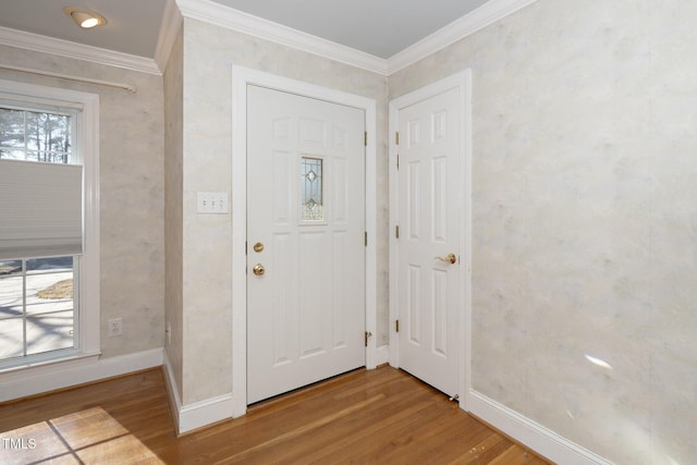 entrance foyer featuring hardwood / wood-style floors and crown molding