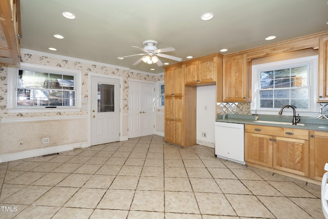 kitchen with ceiling fan, dishwasher, sink, and ornamental molding