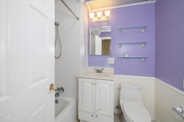 bathroom with vanity, toilet, and a bath