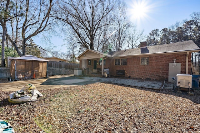 back of house featuring a gazebo and a patio