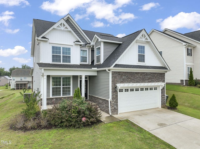 craftsman-style house with a front yard and a garage