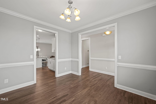 unfurnished dining area featuring dark hardwood / wood-style flooring, crown molding, and an inviting chandelier