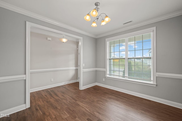 unfurnished room featuring dark hardwood / wood-style flooring, a chandelier, and ornamental molding