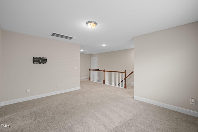 unfurnished room with light colored carpet