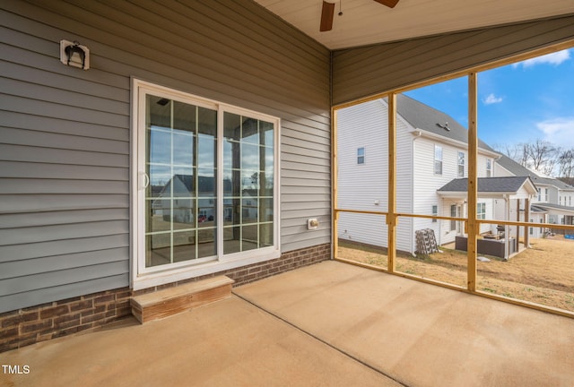 unfurnished sunroom featuring vaulted ceiling, ceiling fan, and wood ceiling