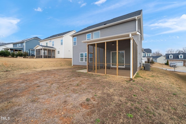 back of house with a sunroom and central AC unit