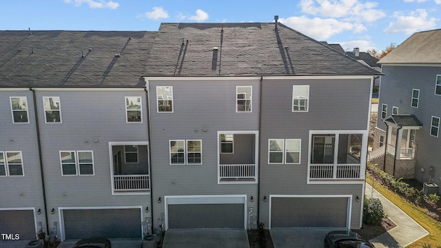 back of property featuring a garage