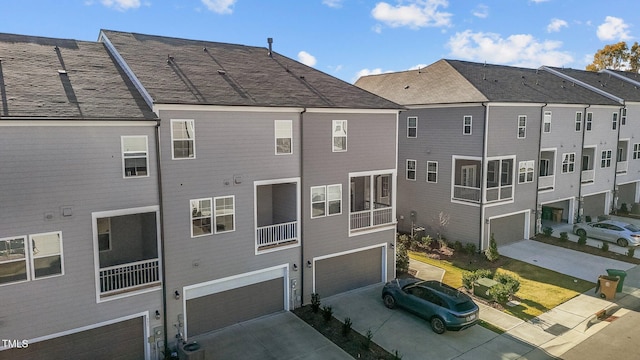 rear view of property with a garage