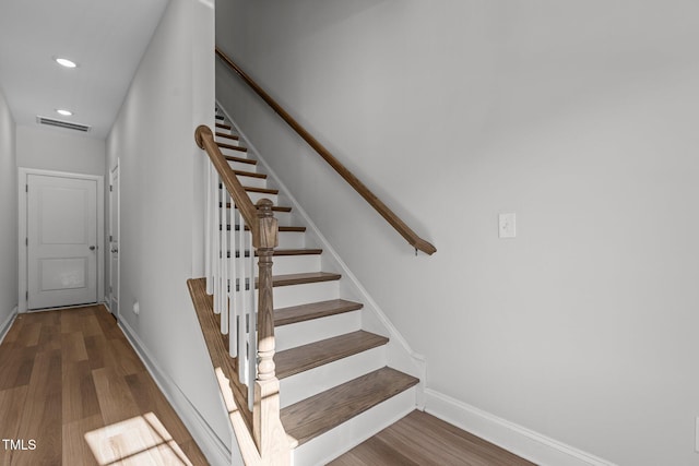 stairway with wood-type flooring