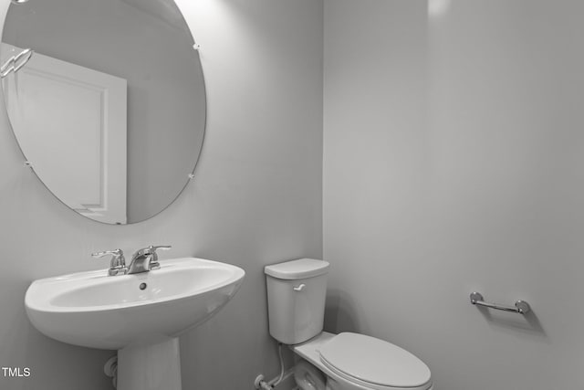 bathroom featuring sink and toilet