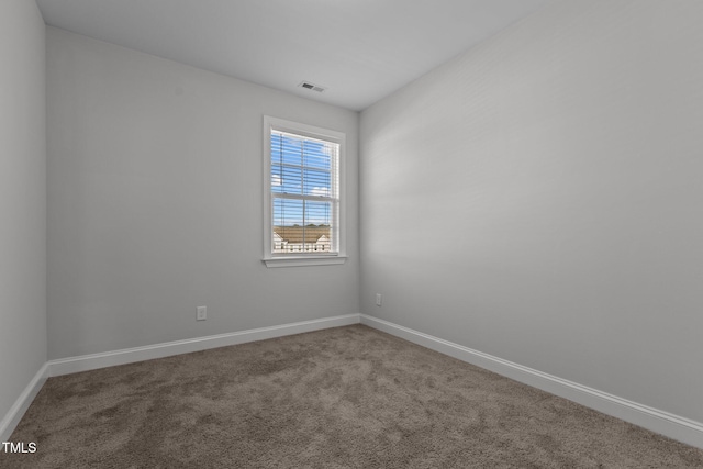 unfurnished room with carpet floors