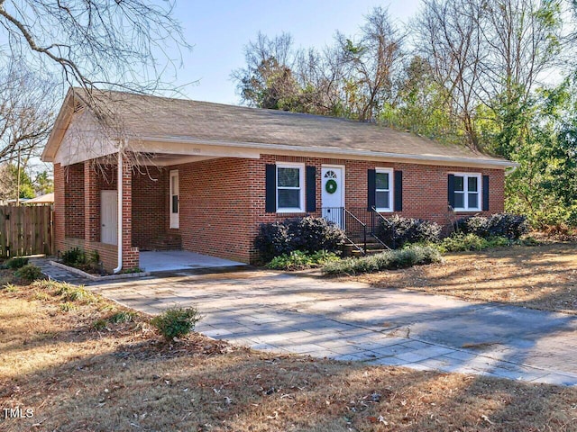 ranch-style house with a carport