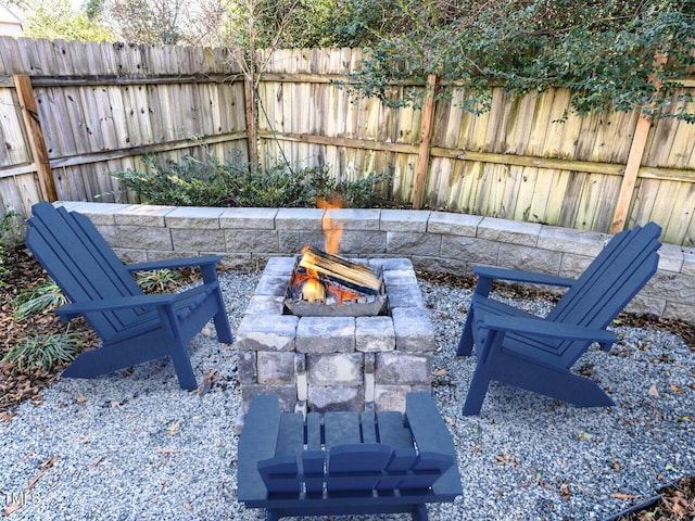 view of patio with a fire pit