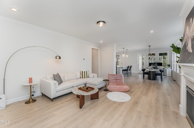 living room with ornamental molding and light wood-type flooring