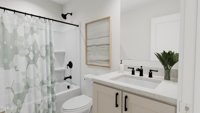 full bathroom featuring shower / tub combo with curtain, vanity, and toilet