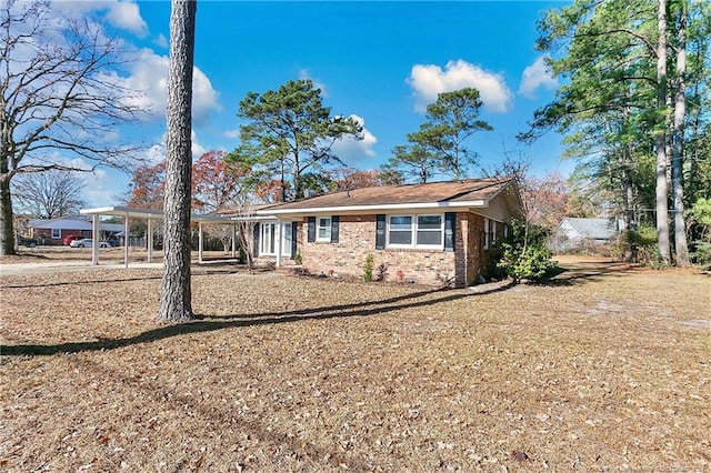 view of front of home with a carport