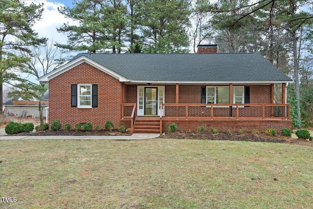 303 Forest Rd, Oxford, NC 27565 - ranch-style home featuring brick siding, a chimney, a front yard, and covered porch