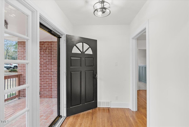 foyer with light hardwood / wood-style flooring