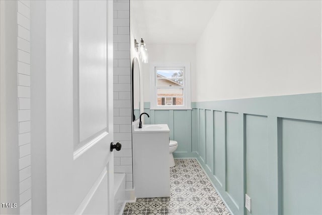 303 Forest Rd, Oxford, NC 27565 - bathroom with wainscoting, tile patterned floors, and vanity