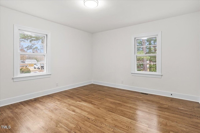 303 Forest Rd, Oxford, NC 27565 - empty room featuring plenty of natural light and wood finished floors